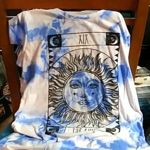 White t_ shirt with a sun printed on shirt